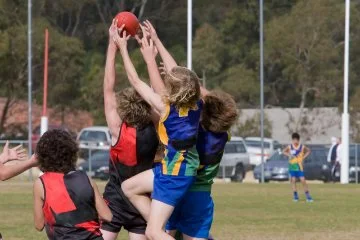 Youths leaping to take a mark